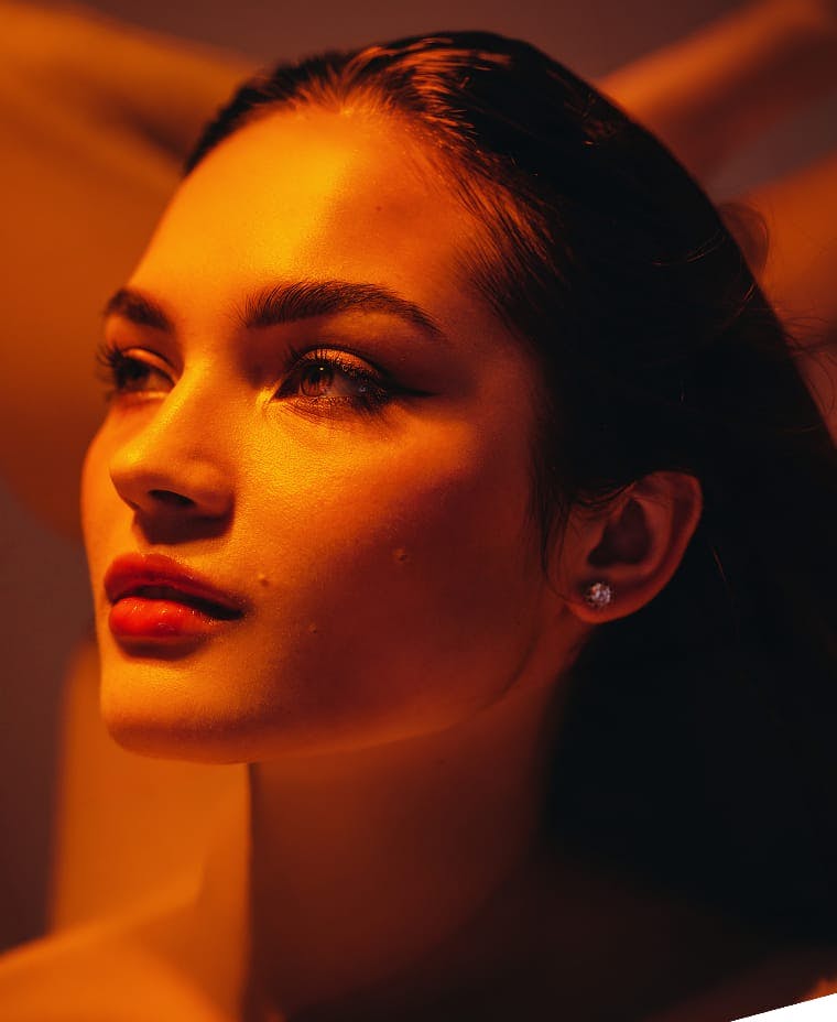 woman with a red light shining on her face