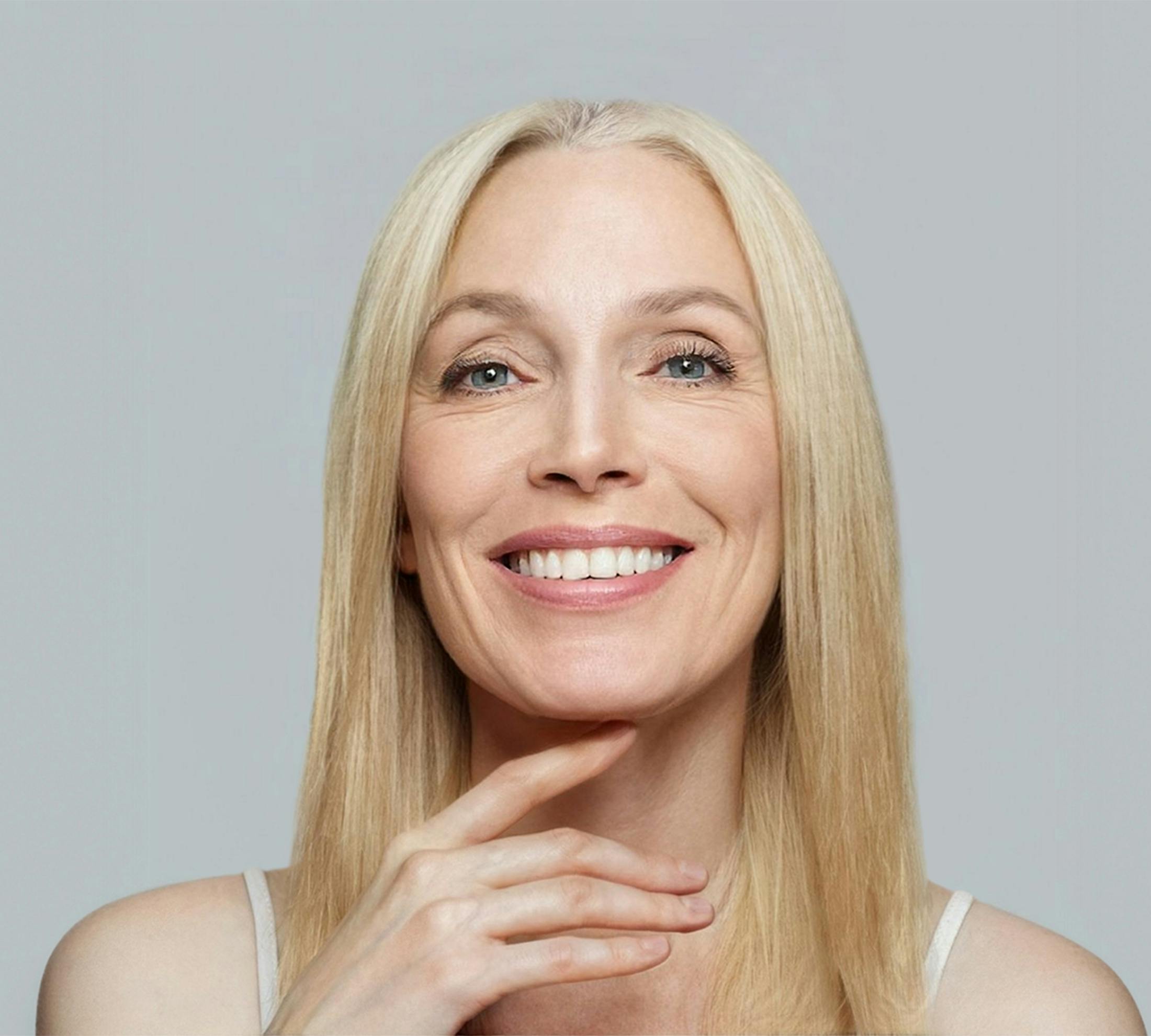 woman touching her face