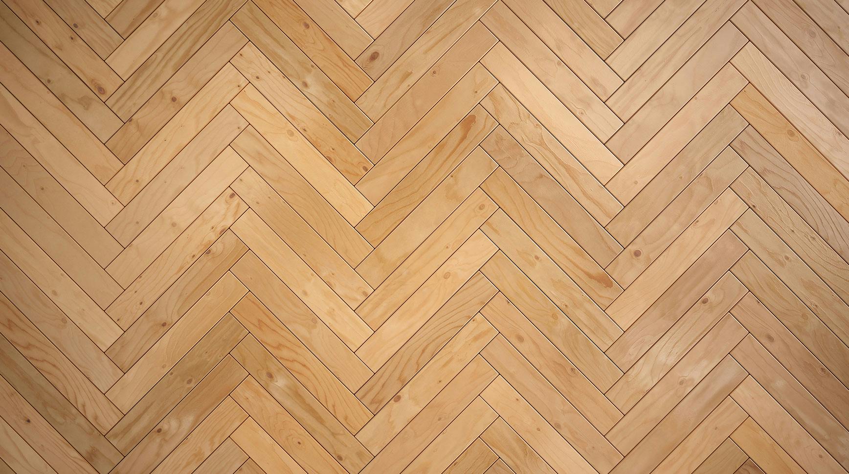 Light oak flooring laid in a herringbone pattern