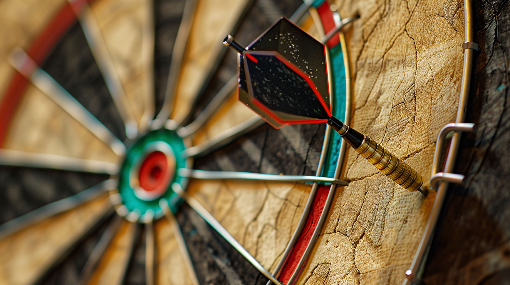 Close-up of a dart stuck in the outer ring of a dartboard, well off the bullseye