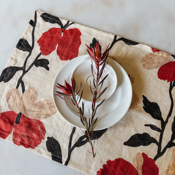 Red poppy placemat with a plate setting
