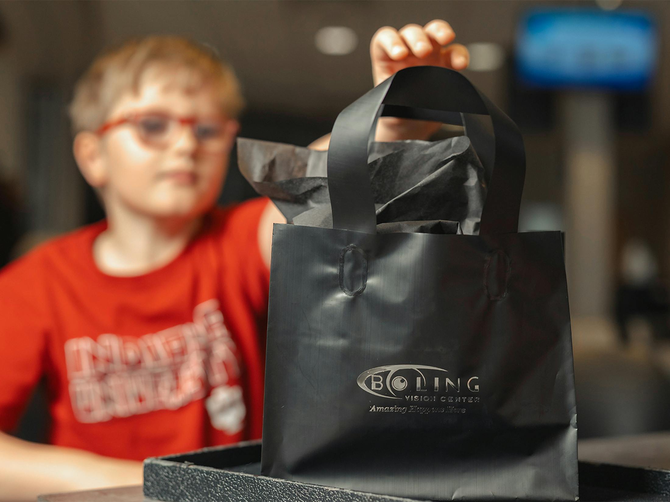 A child grabbing a bag