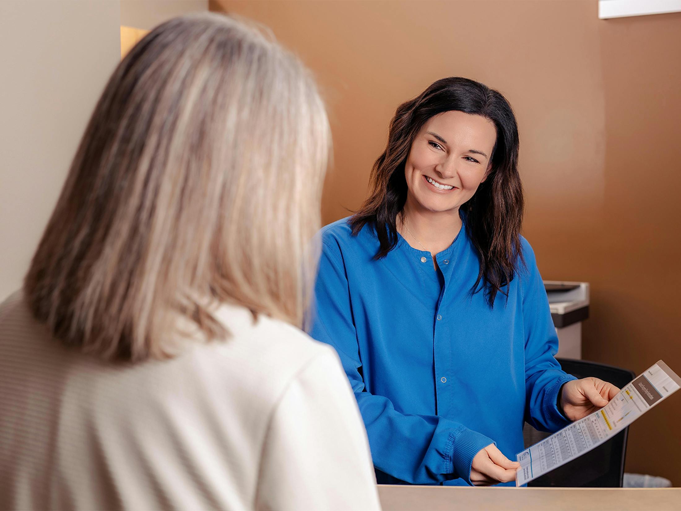 two women looking at a chart