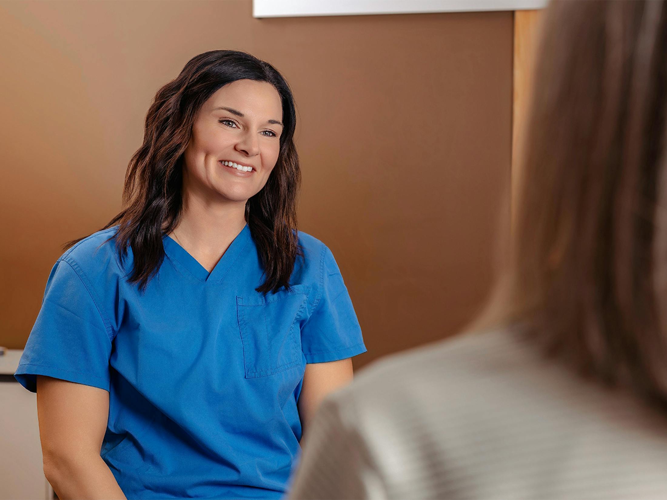 woman smiling at a patient