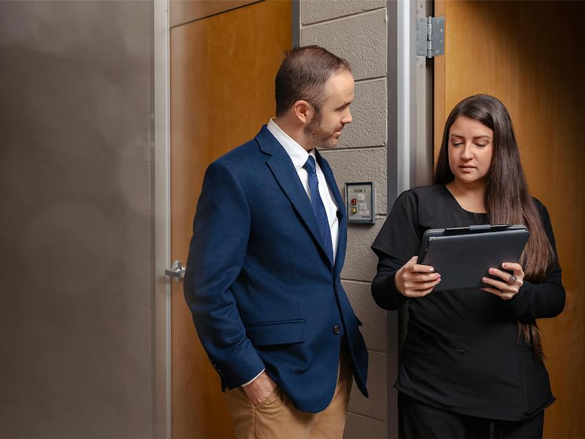 two people looking at a tablet