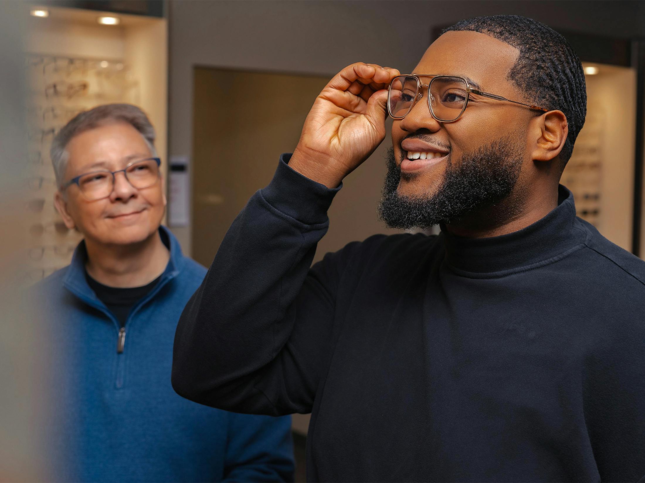 Man trying on glasses