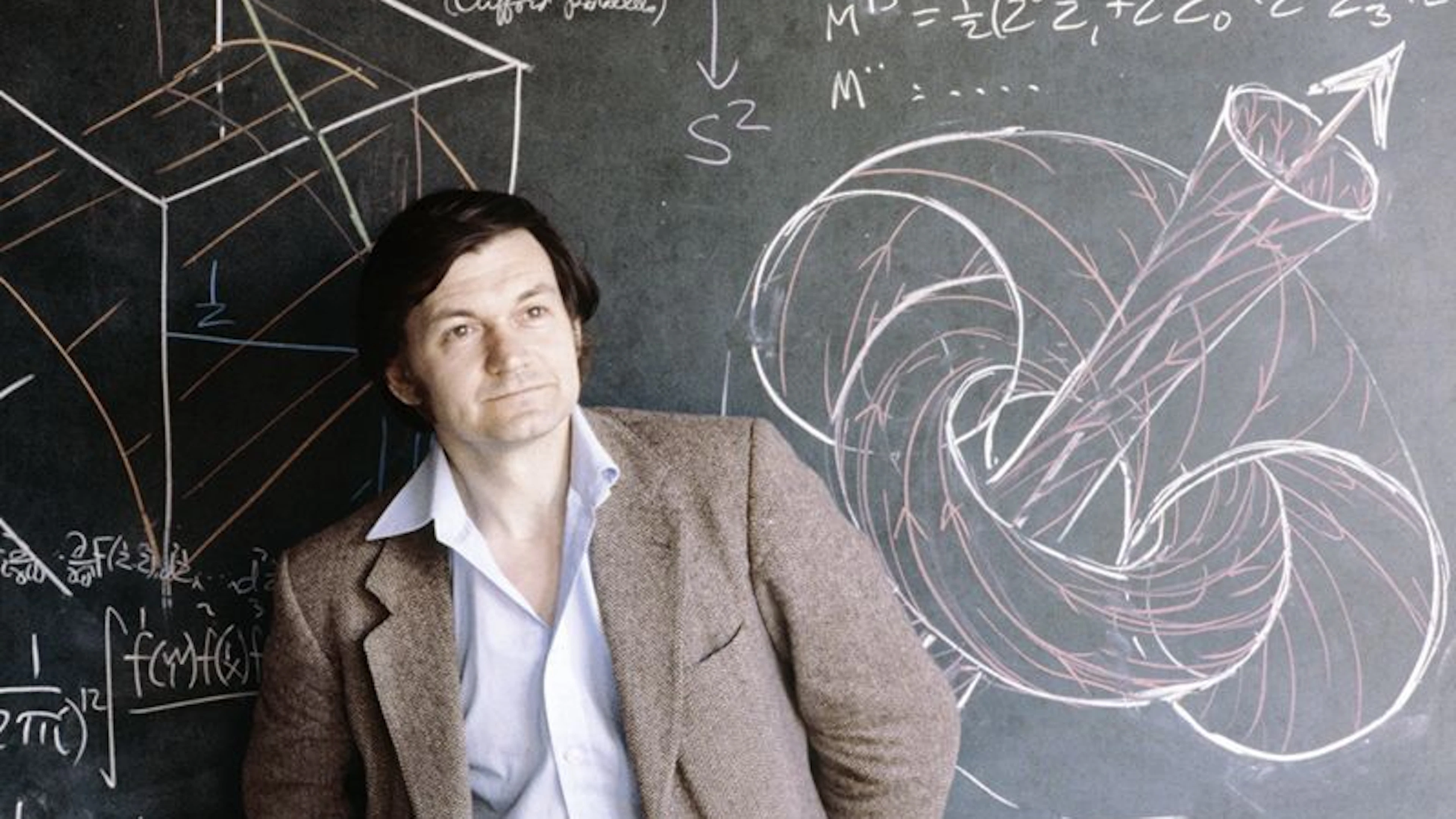 De jonge Penrose (©Anthony Howarth) De jonge Penrose poseert naast een topologisch krijtuniversum (©Anthony Howarth)