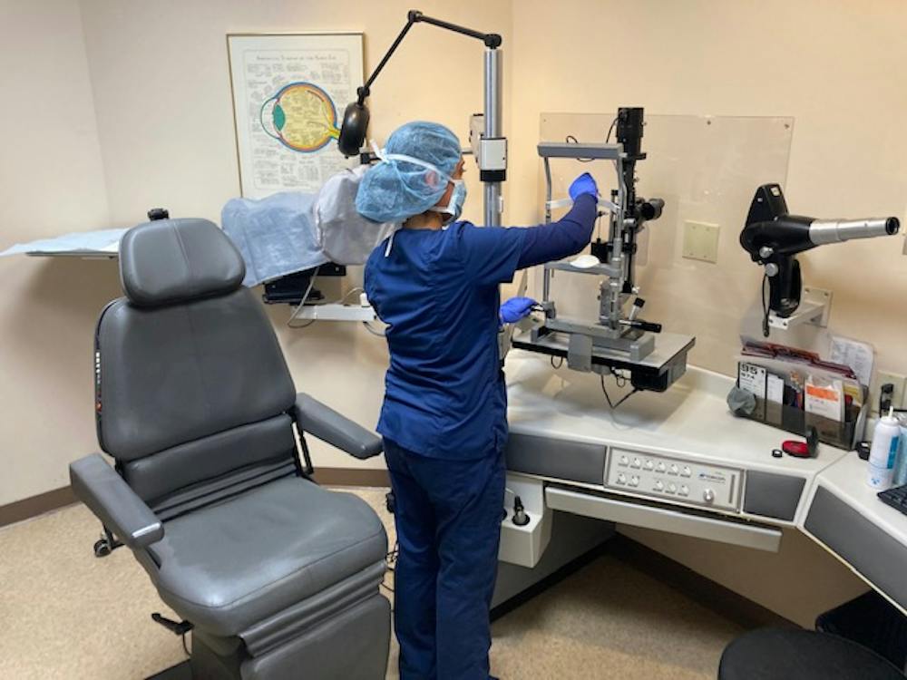 All surfaces in contact with patients are sanitized after every patient. Other surfaces near staff and patients are wiped down at least hourly.