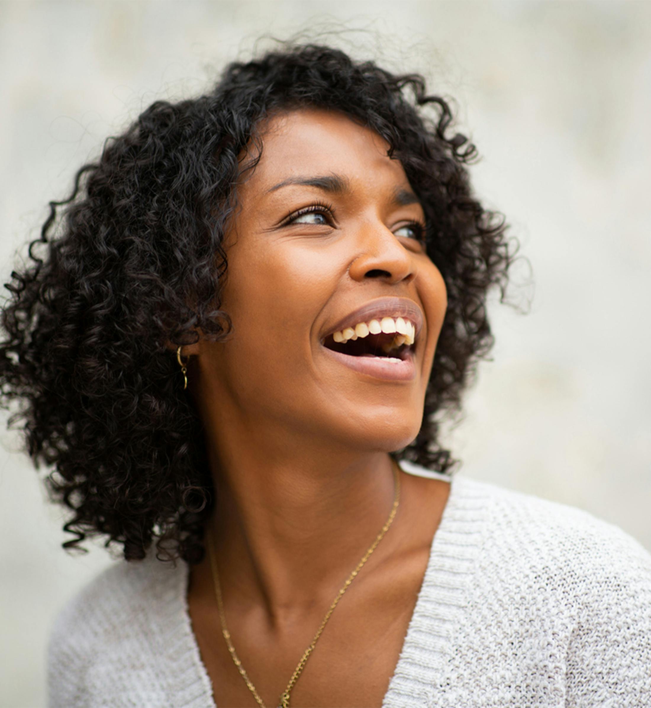 woman smiling to the side