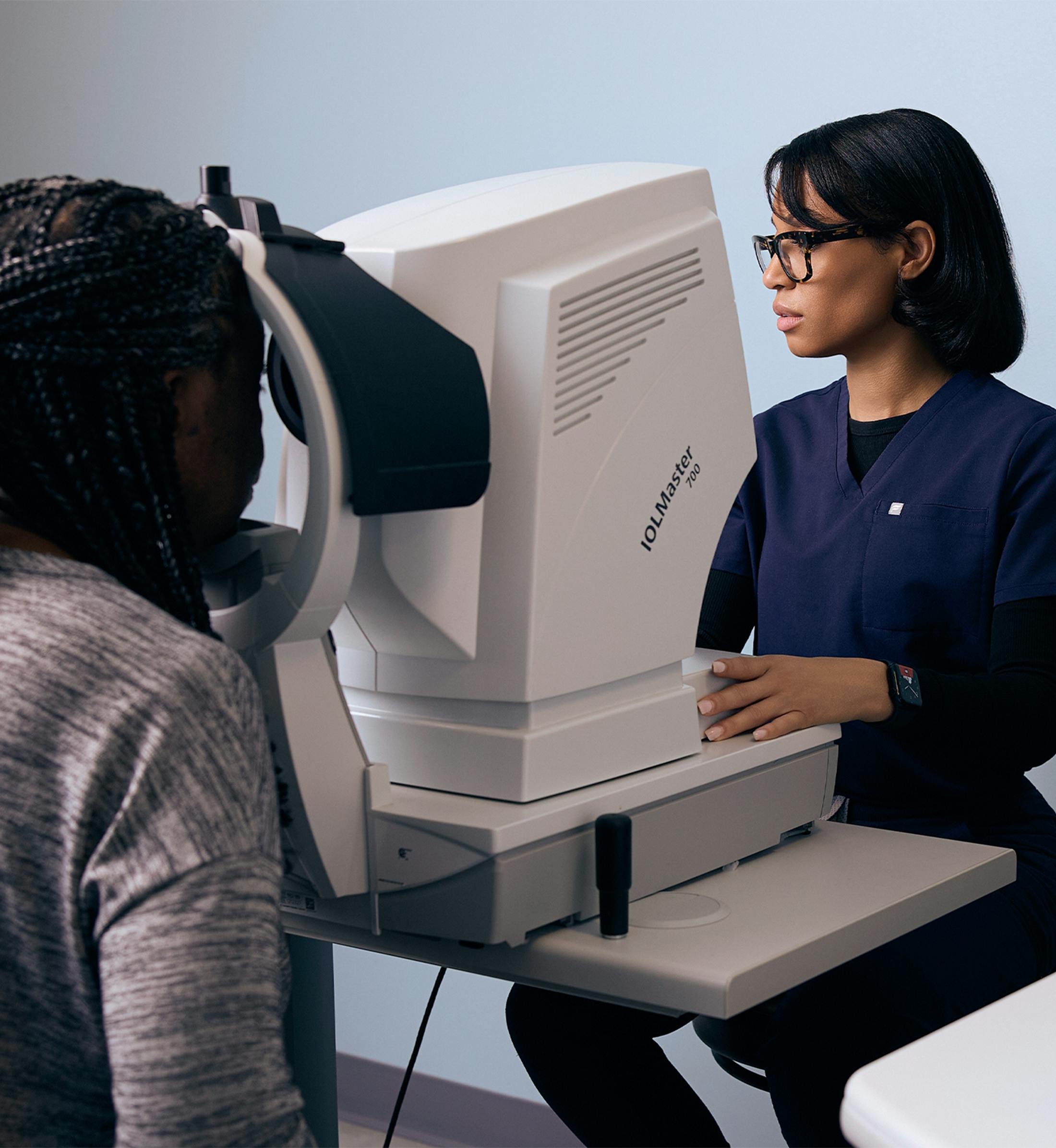 doctor testing a patient's eyes