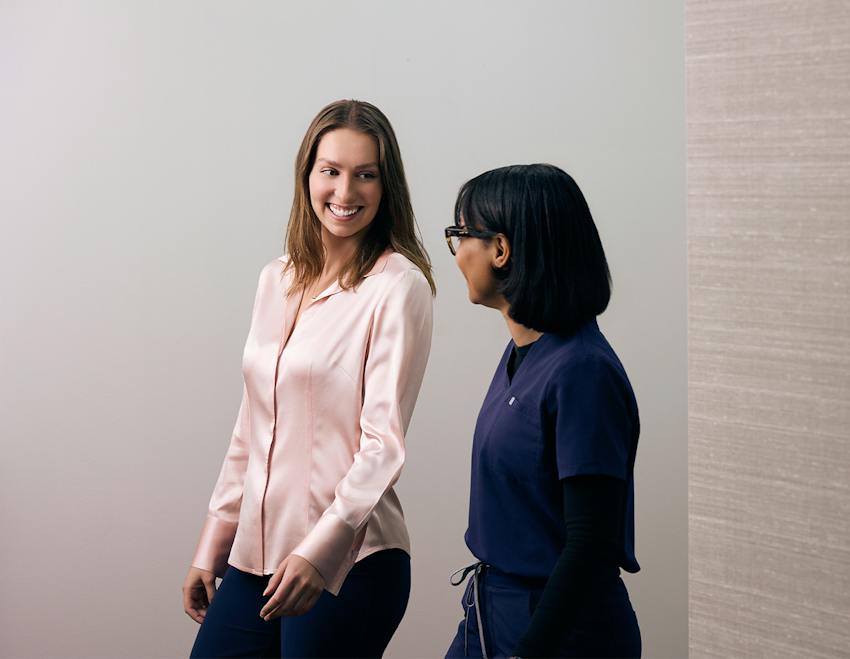 Woman and doctor smiling