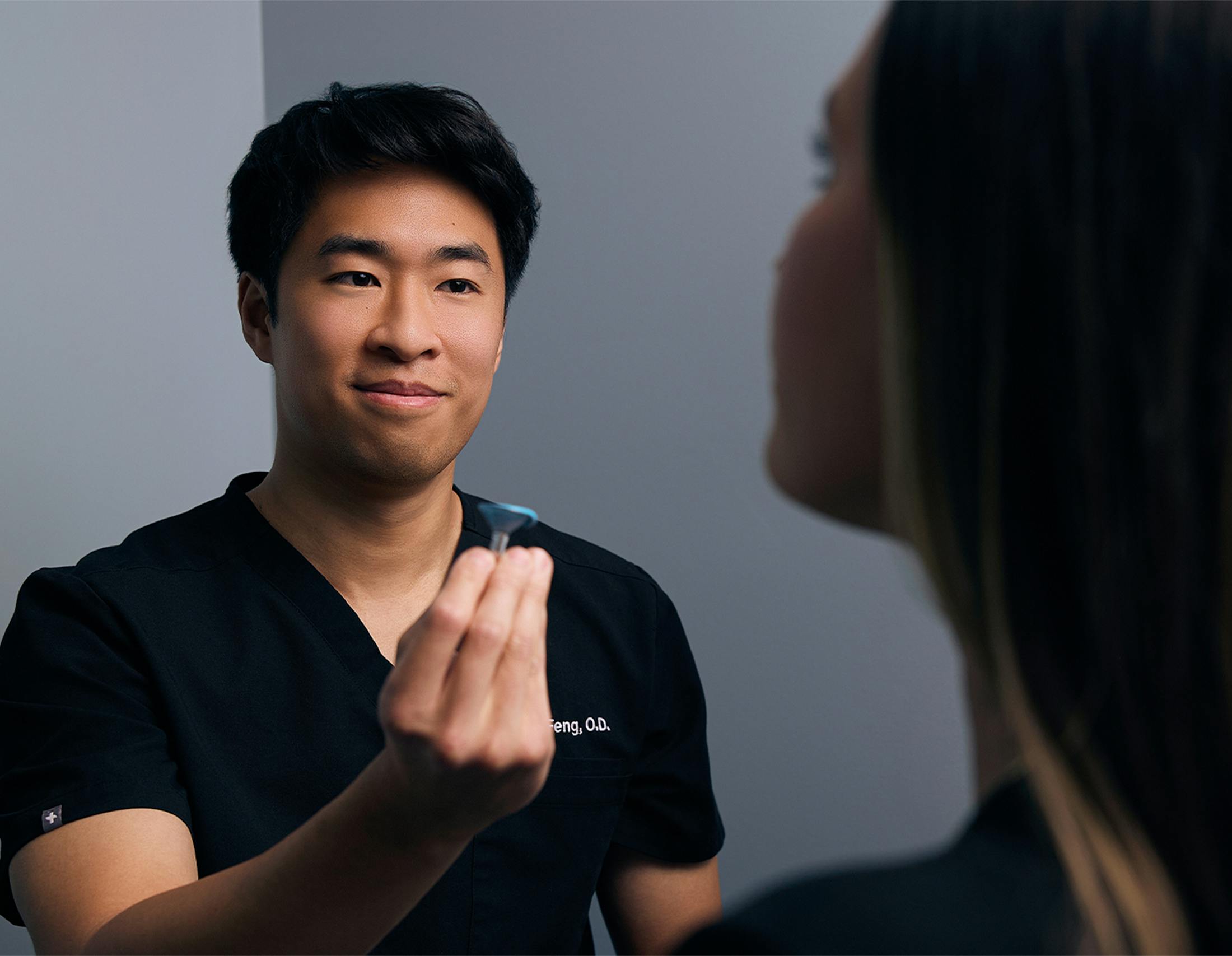 doctor showing a patient a model