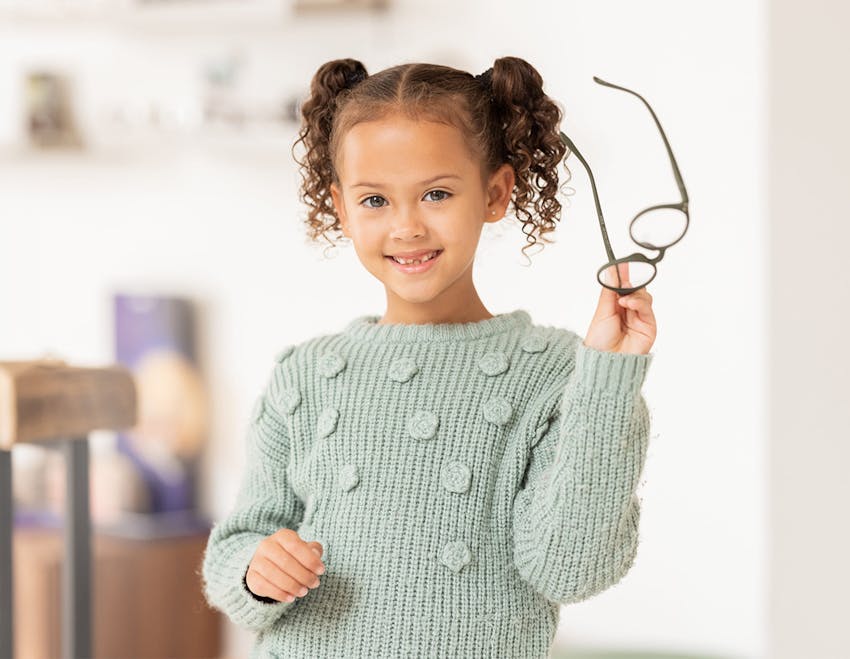 child holding glasses