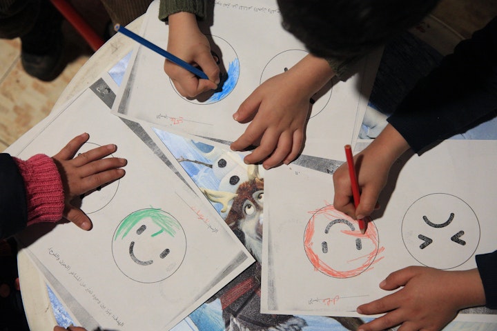 Schoolchildren drawing faces