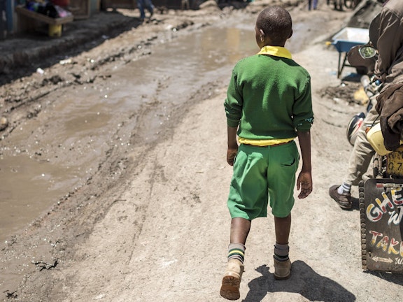 A boy walking on the street in Nairobi