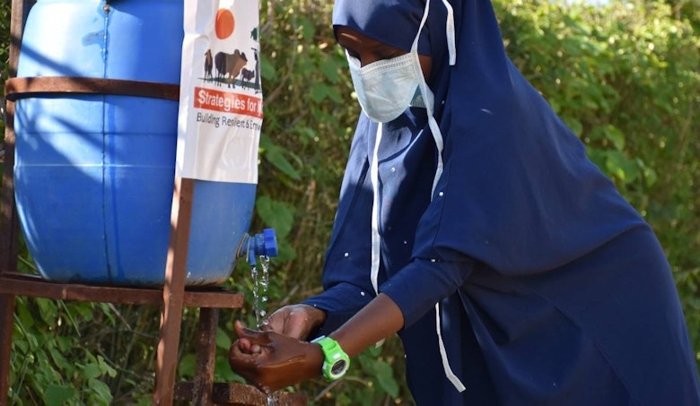 Girl washing her hands in Marsabit County, Kenya