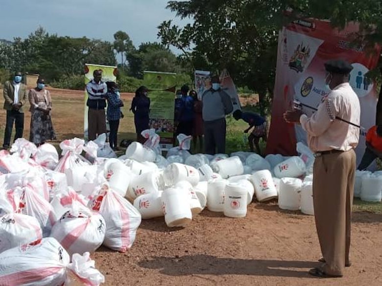 Assistant County Commissioner at the distribution of essential goods to flood victims in Busia