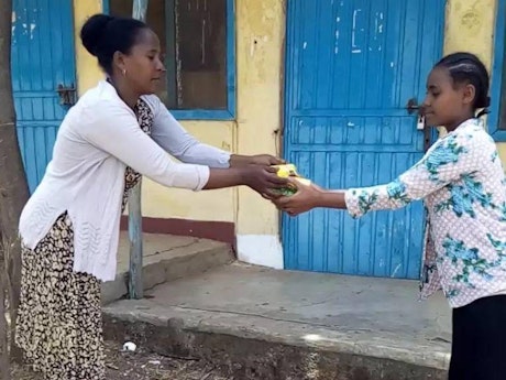A pupil receives hygiene items to help prevent COVID-19 in Amhara Region, Ethiopia