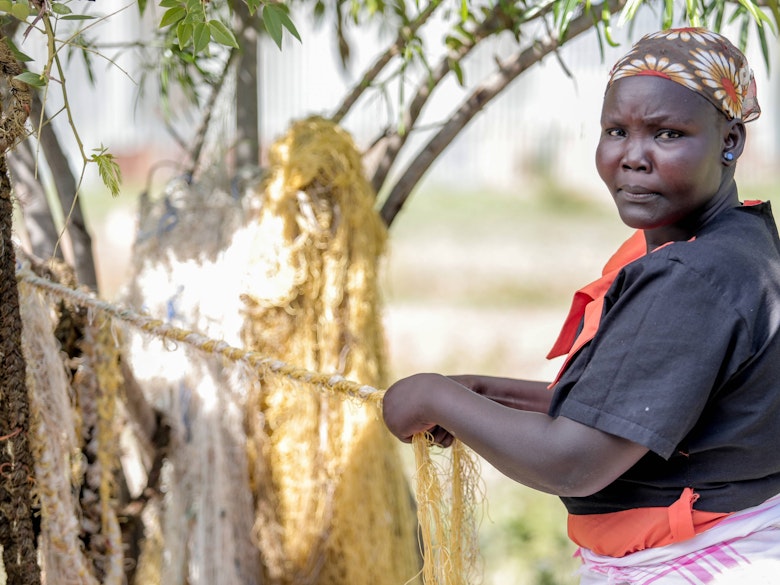 Sophia's mother weaving ropes