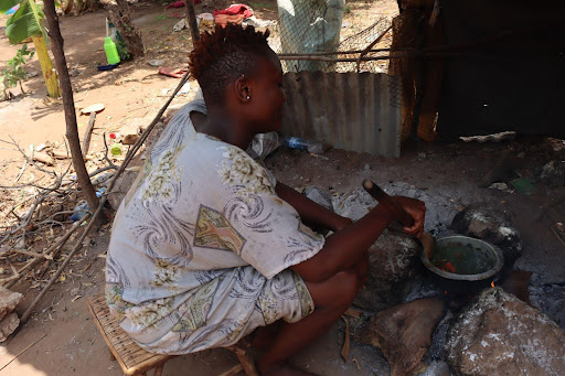 Participant, Amina, cooking for her family at home. Photo credit: Kesho Kenya
