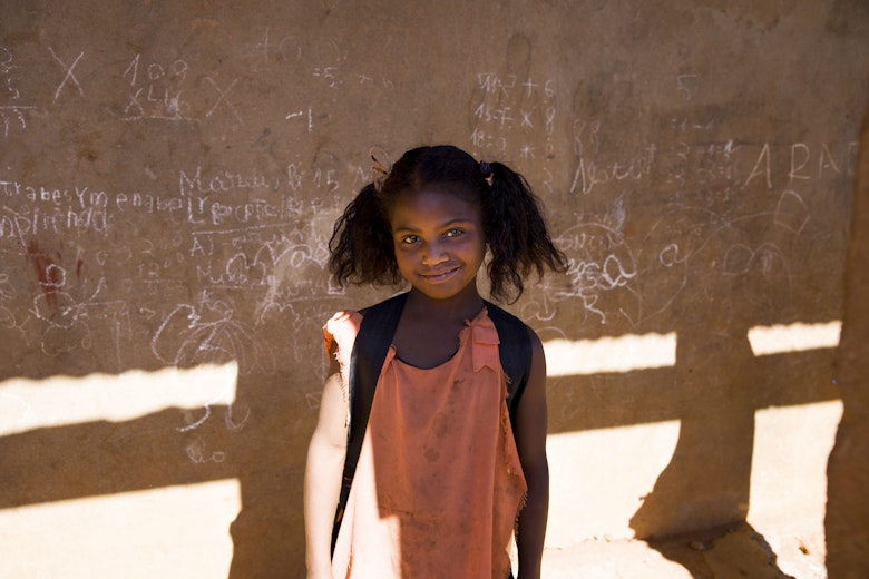 Rosia from Madagaskar no longer works in the mica mines. She enjoys going to school everyday.