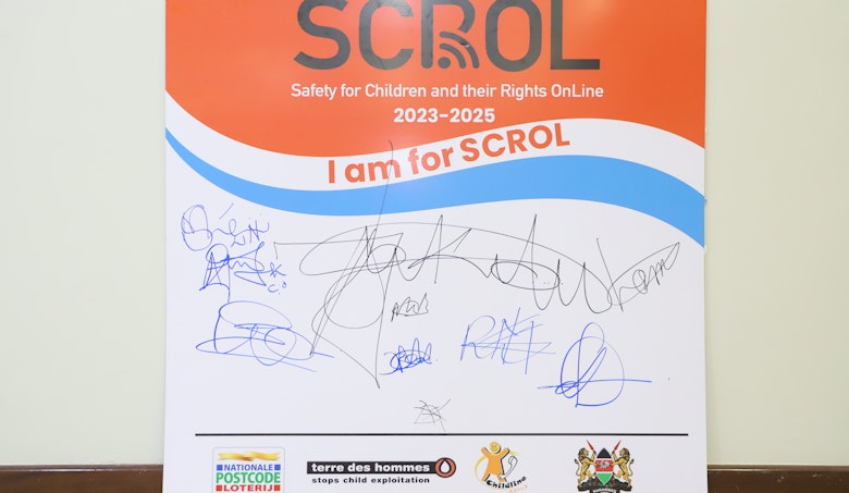 SCROL sign board with signatures by participants