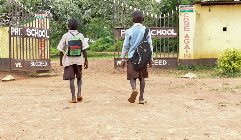 Indukhulu walking to school with his step brother