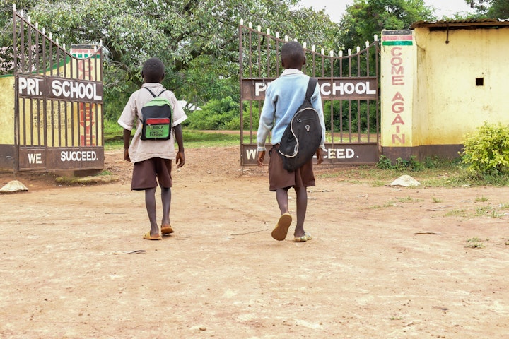 Indukhulu walking to school with his step brother