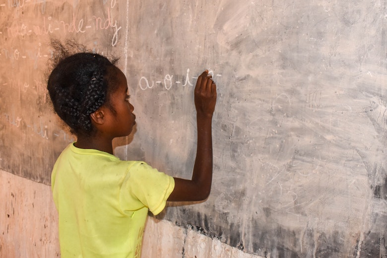 Mary writing on a board