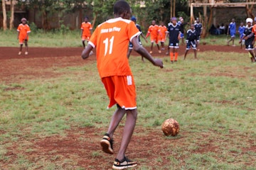 Prince playing football with his friends