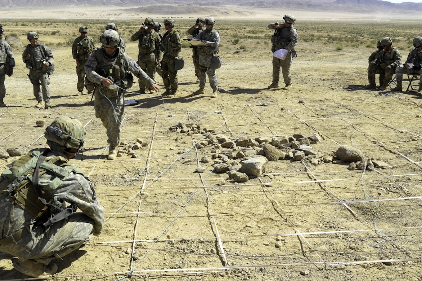 Soldiers with the Kansas Army National Guard prepare a rock drill prior to a combined-arms rehearsal at the National Training Center.