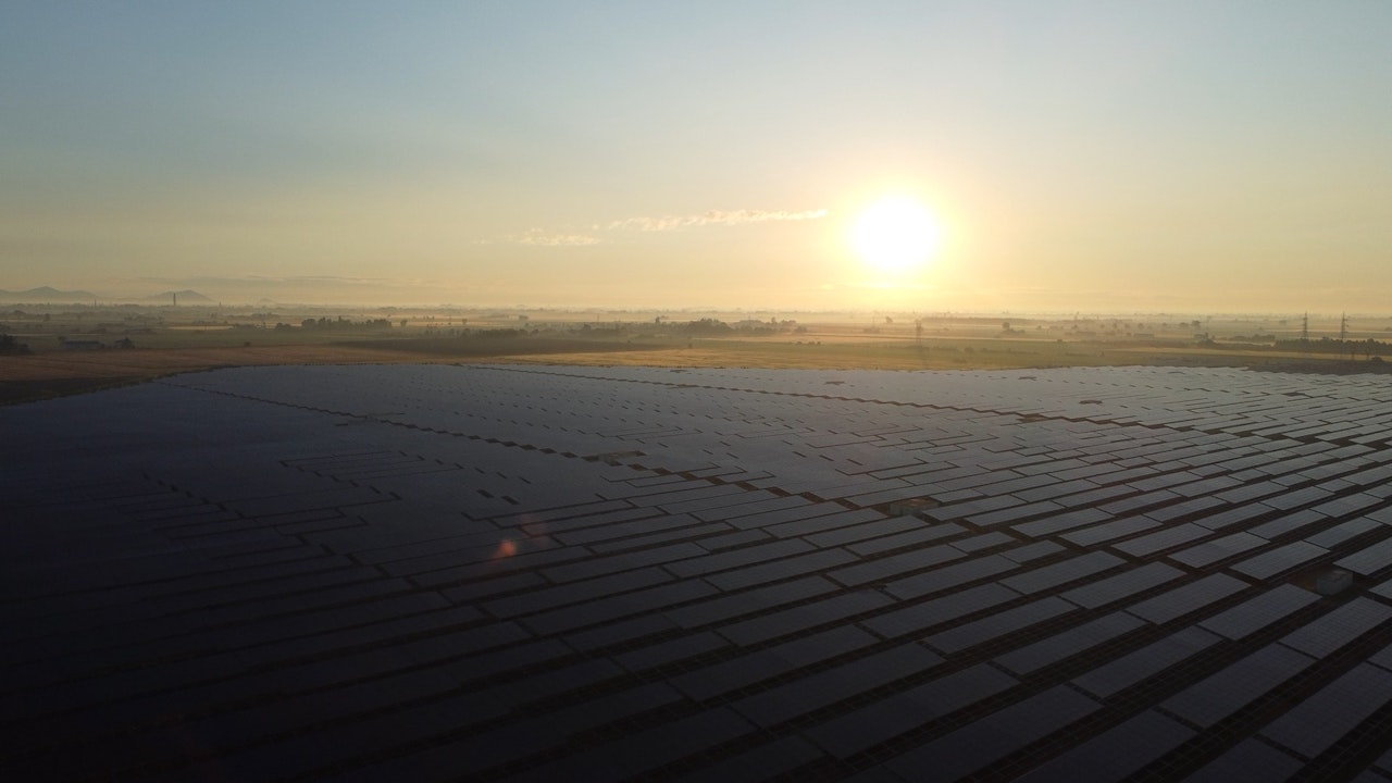 A Delos Power technician monitoring a large-scale photovoltaic plant
