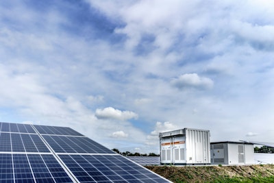 White and black solar panels under white clouds and blue sky during daytime.