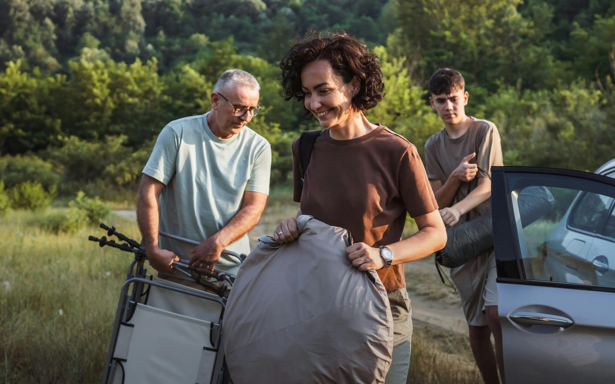 family carrying bags