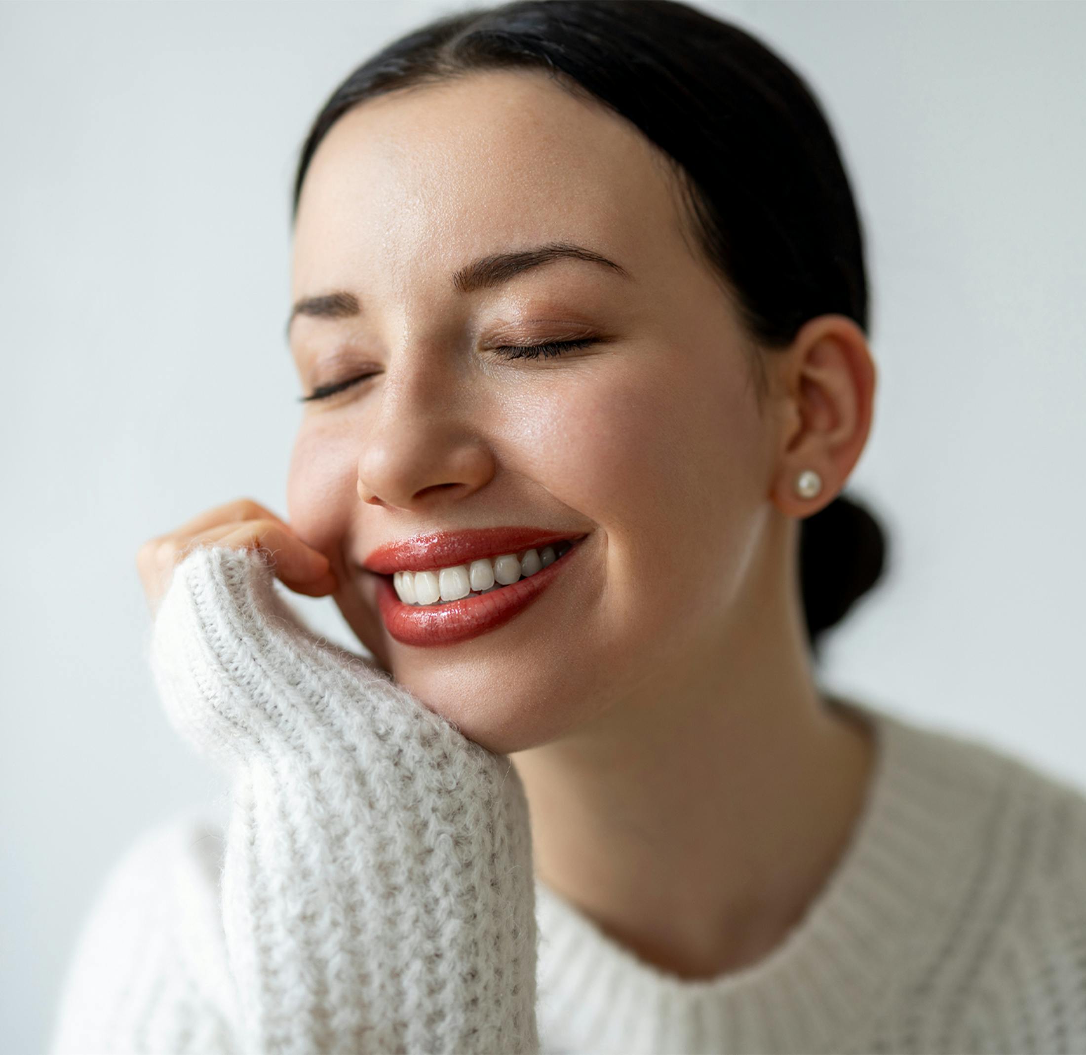 woman in a white sweater