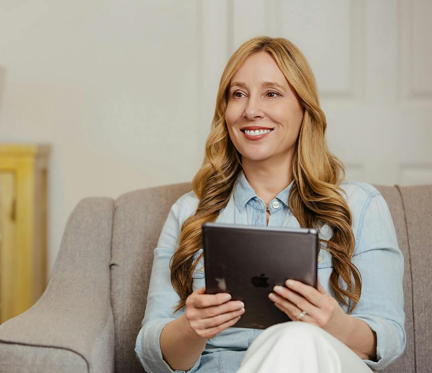 woman holding a tablet