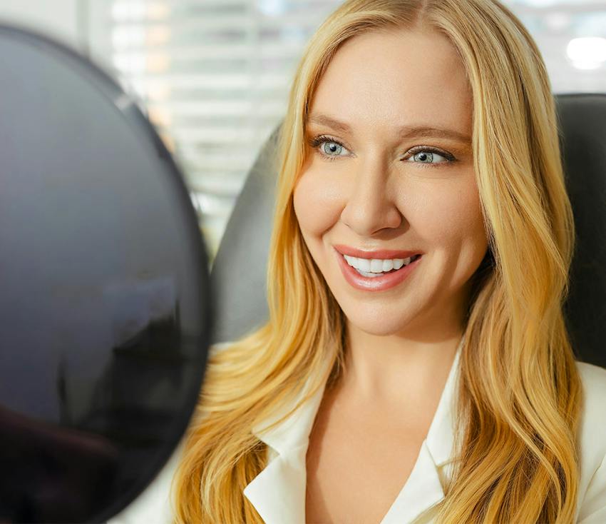 woman with blonde hair smiling