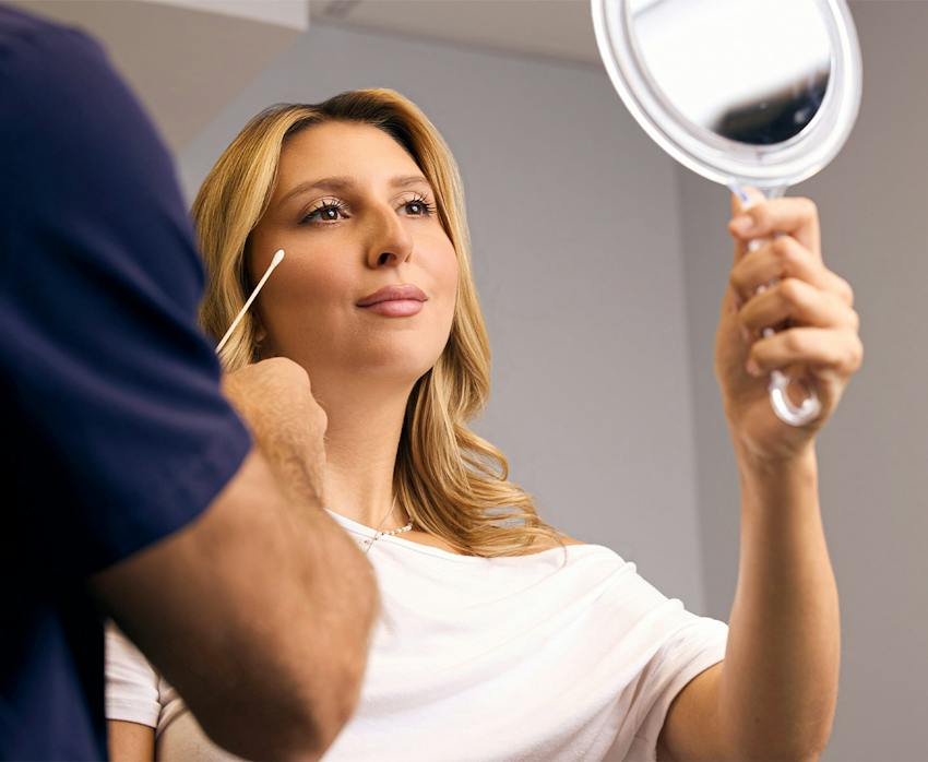 women holding a mirror