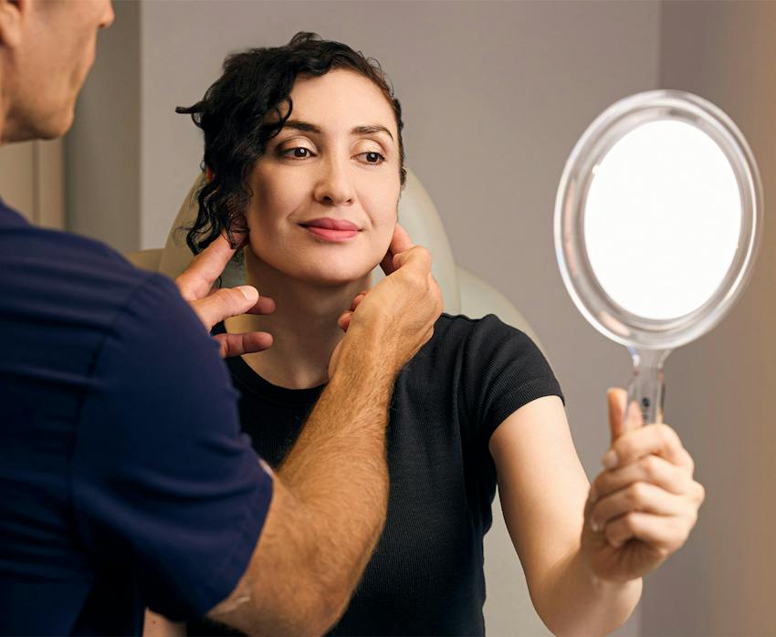 A woman looking in a mirror