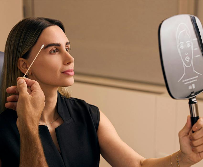 A woman looking in the mirror