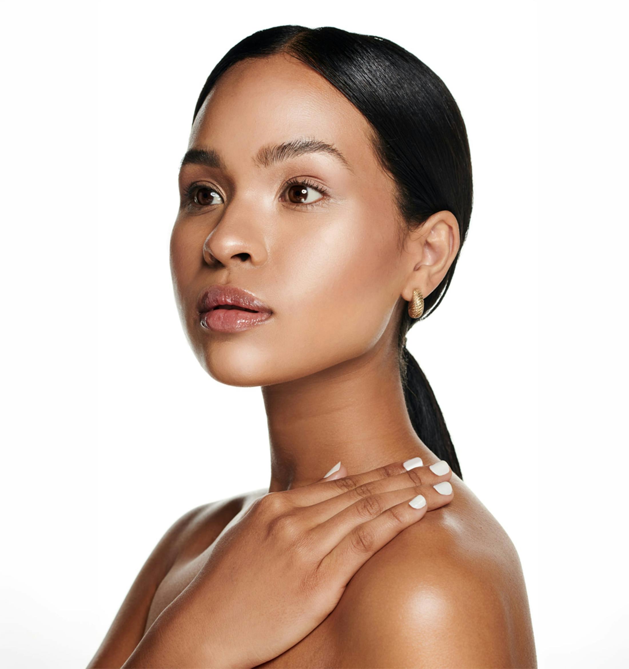 A woman touching her shoulder