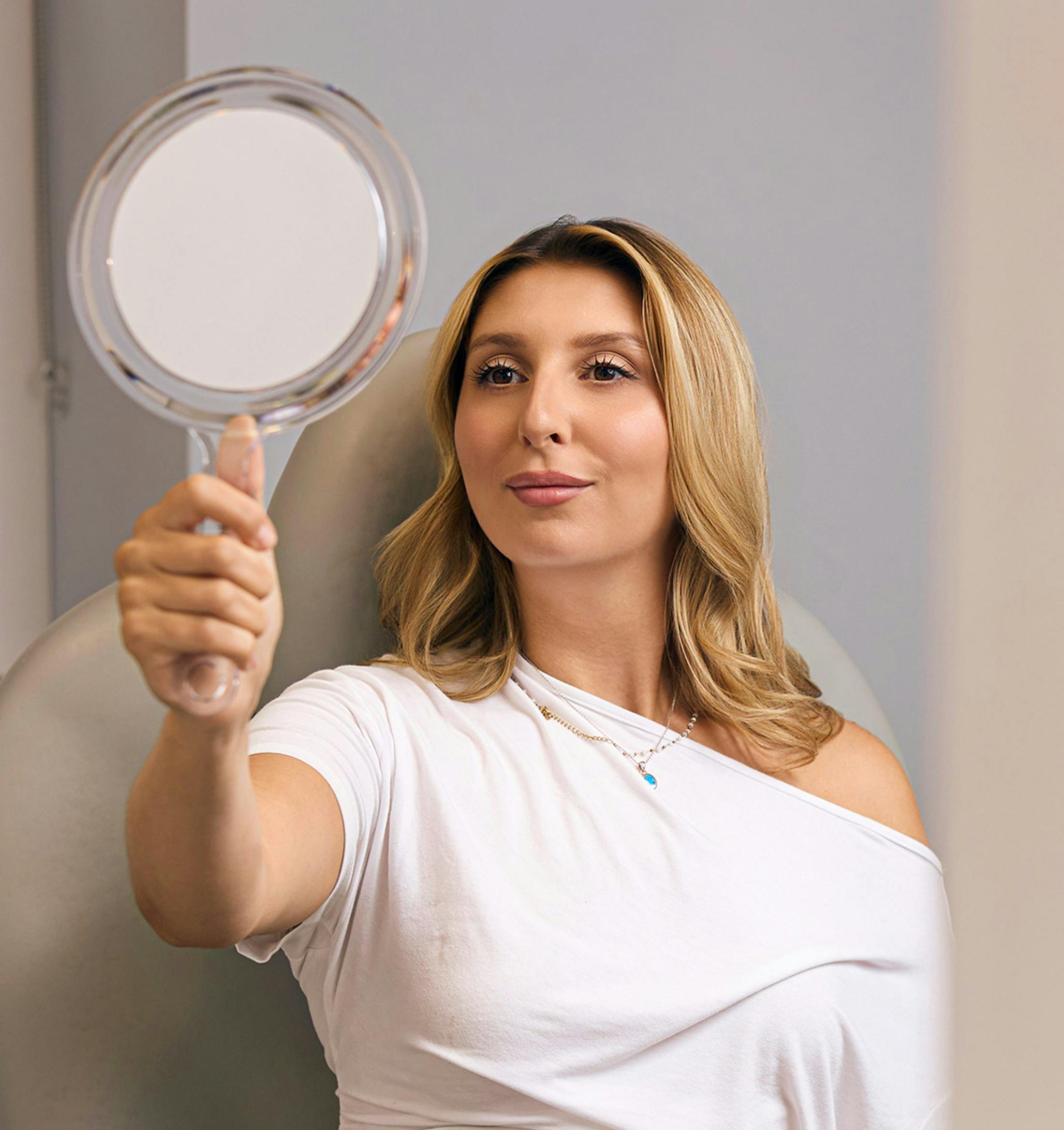 A woman looking in a mirror