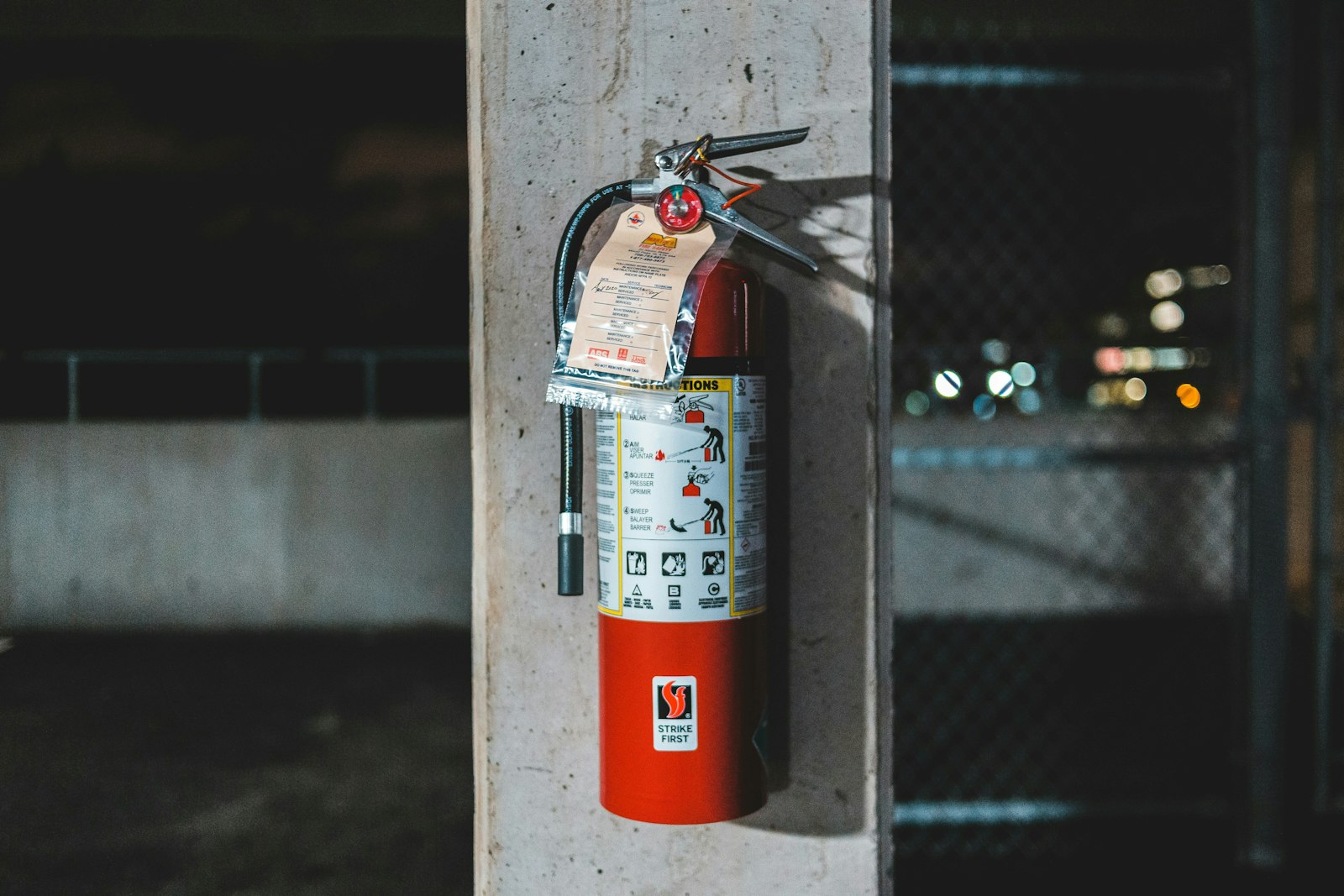A red fire extinguisher mounted on a wall.