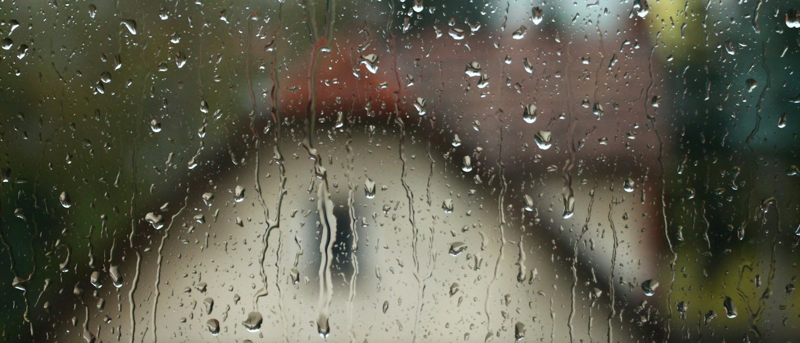 A window blurred by raindrops.