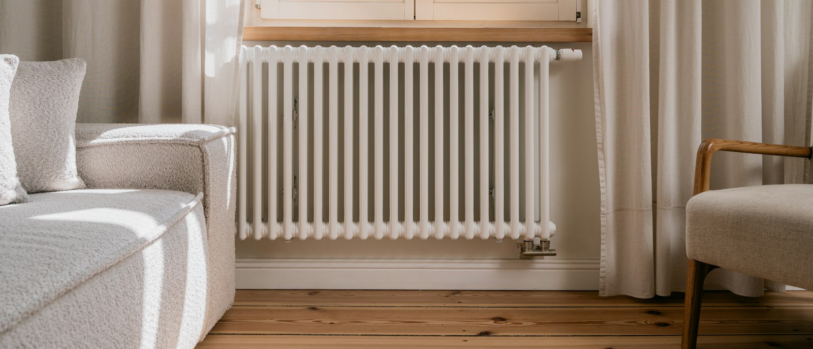 A white radiator in a living room.
