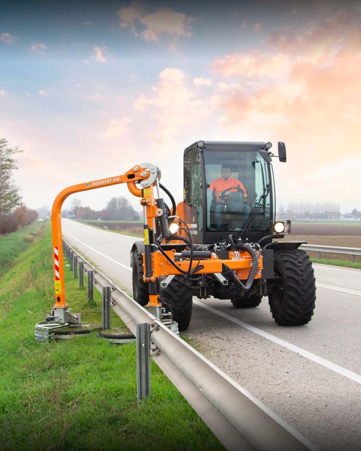 An Energreen Discovery 840 self-propelled machine trimming a roadside guardrail