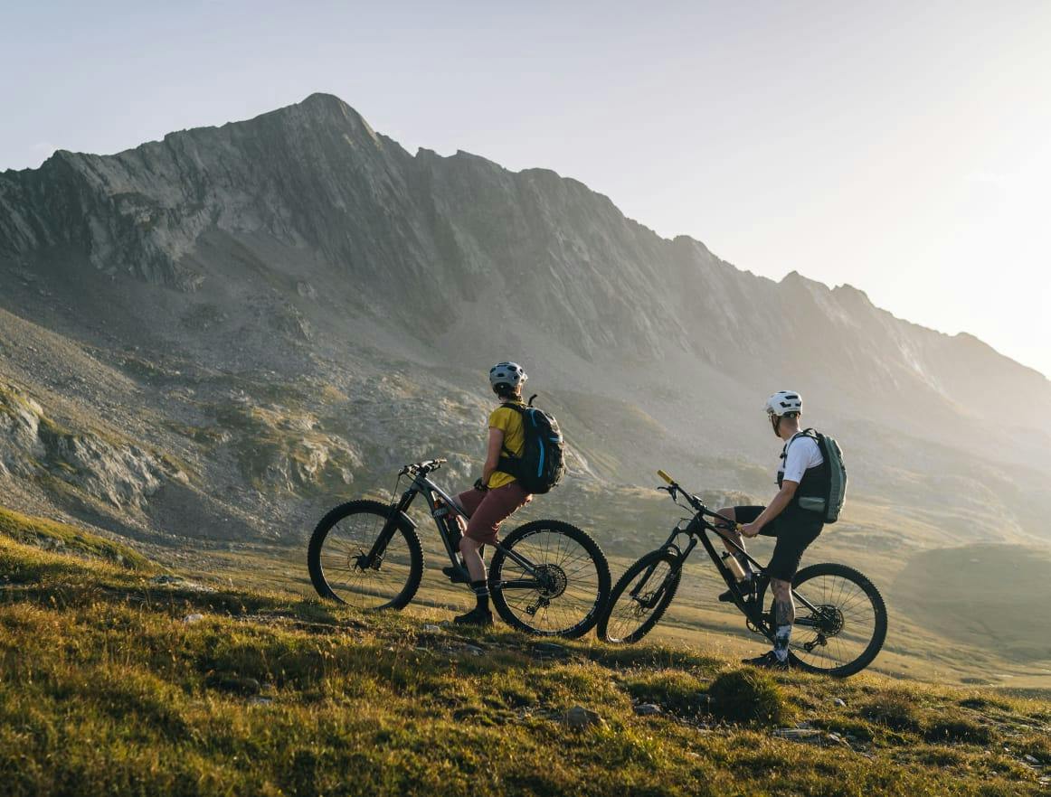 Two people riding bikes