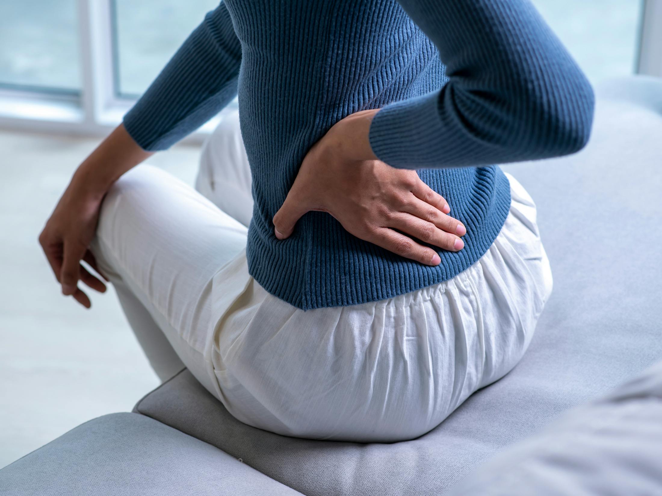 A person holding their hip