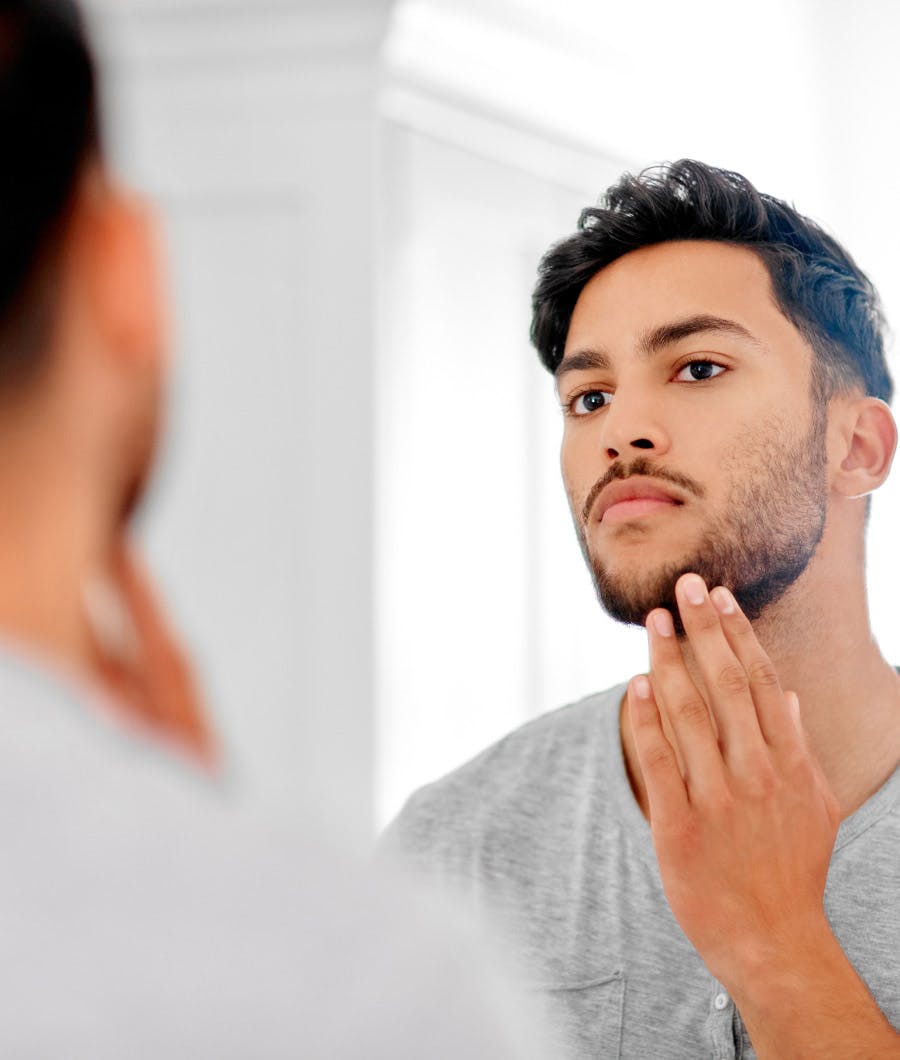 Man touching his beard