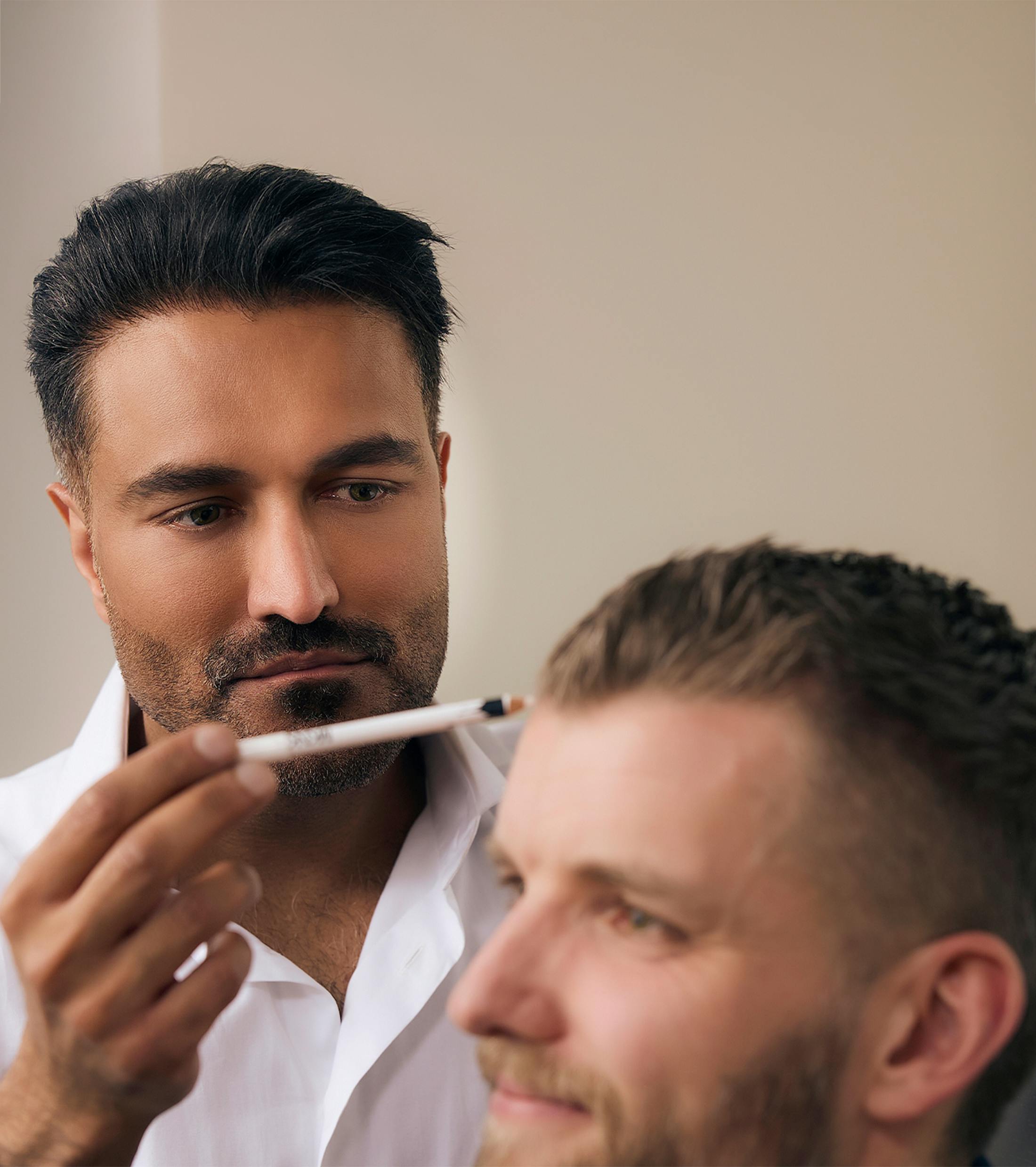 doctor marking a patient's hairline